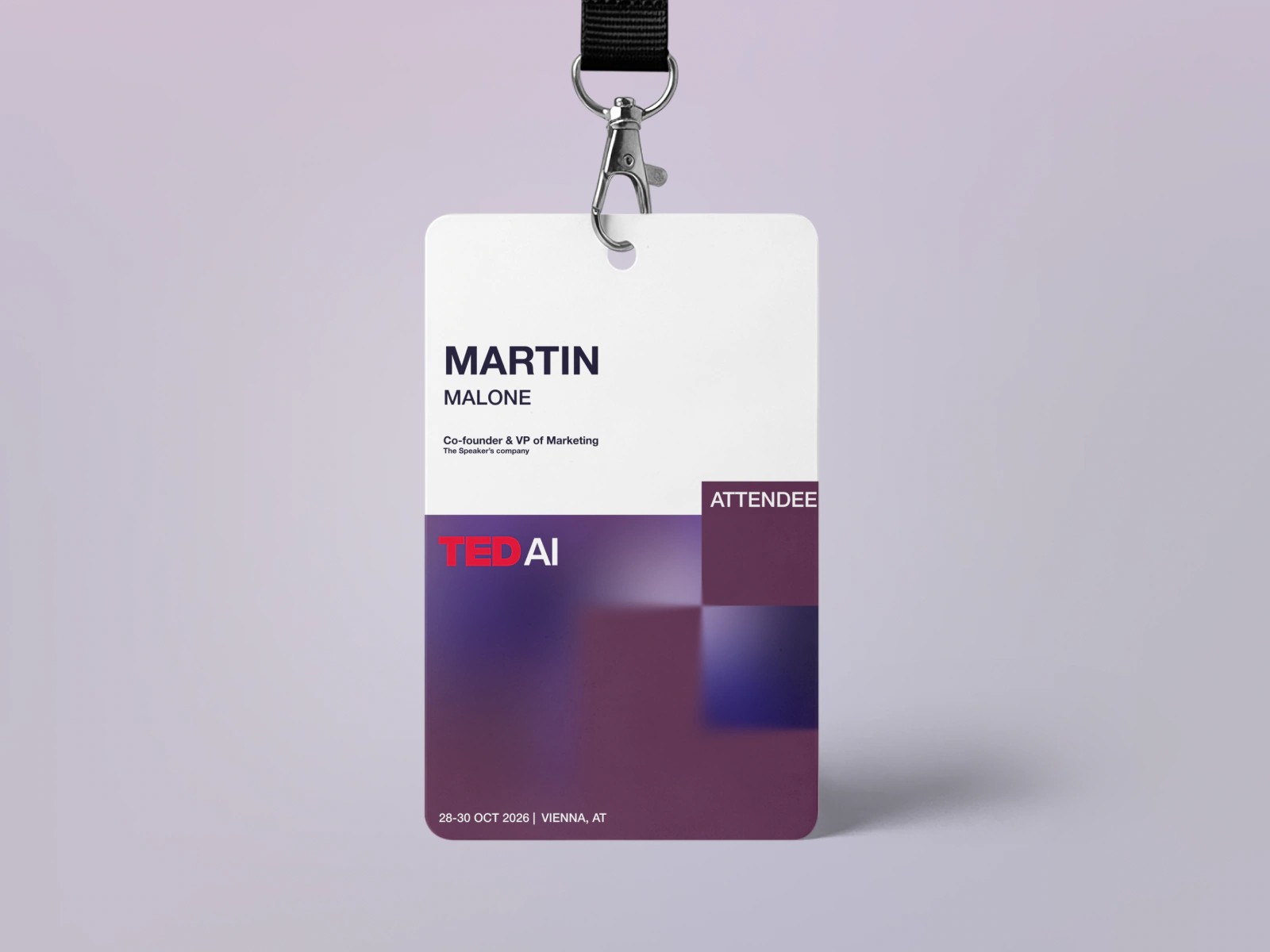 TEDAI Vienna attendee badge on a black lanyard, purple and white with the TEDAI logo
